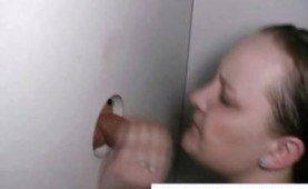 Chubby teen sucking cock through a glory hole